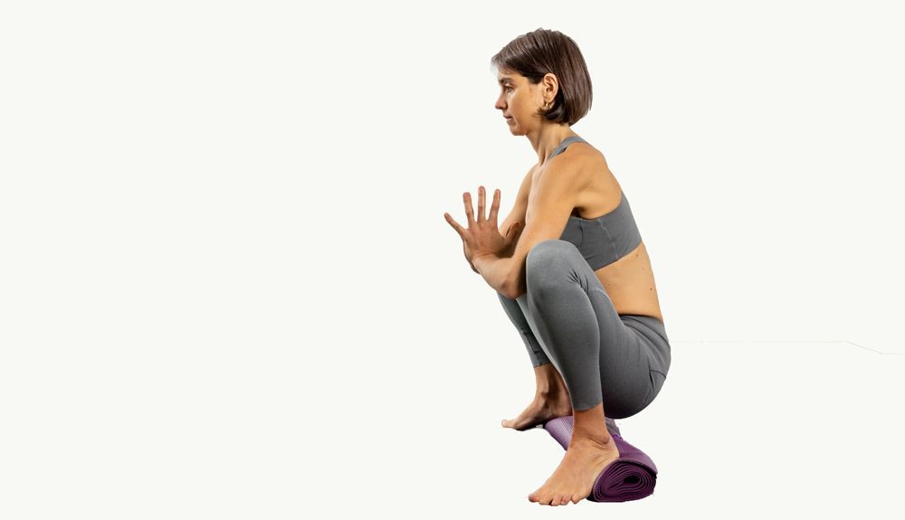 Malasana con apoyo en los talones Malasana con apoyo en los talones